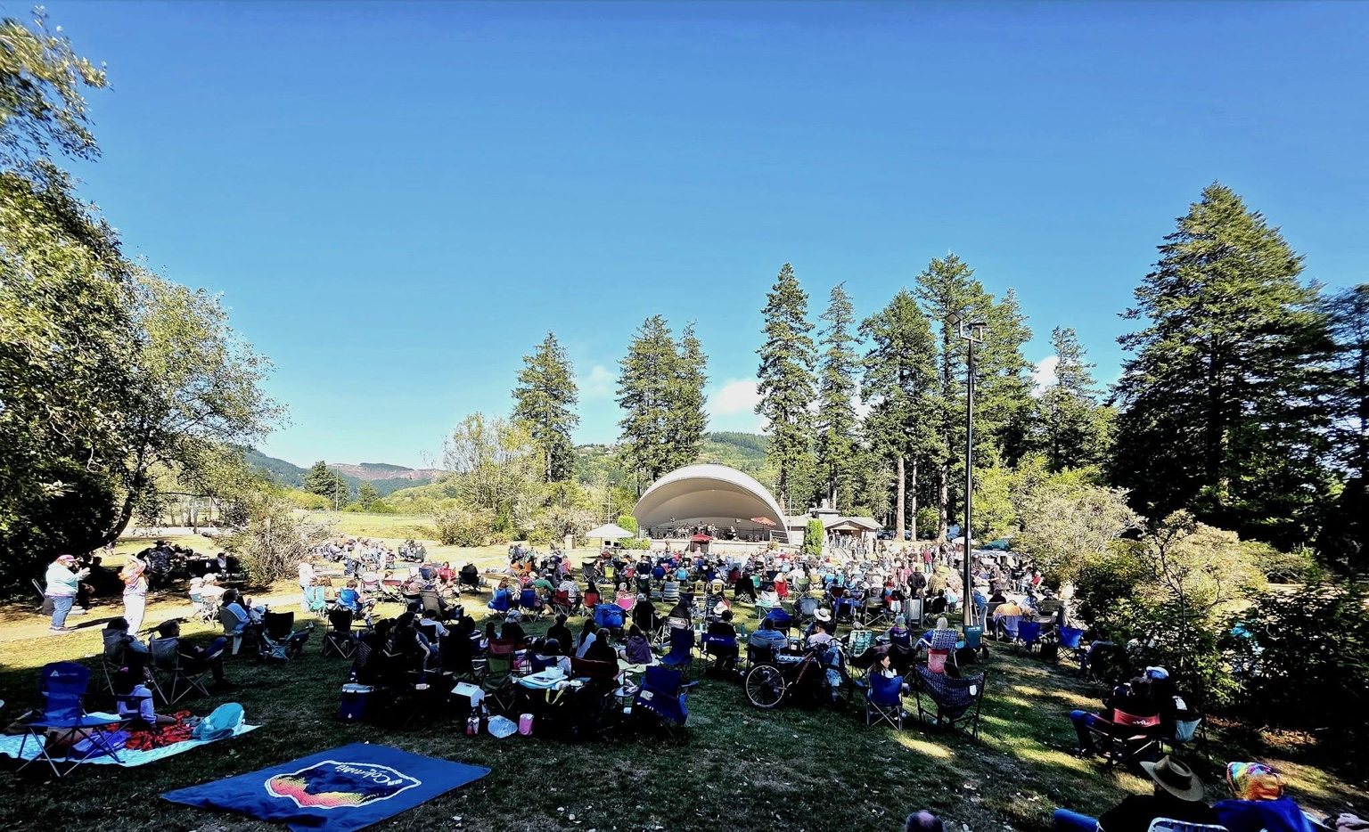 Outdoor audience facing a concert stage at Jesus Jam 26